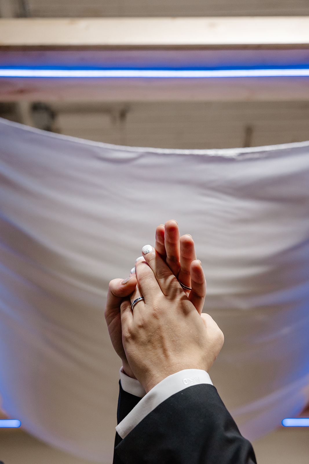 grooms hands entertwined