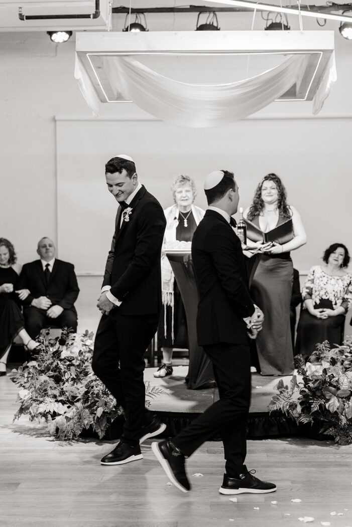 grooms walk around each other