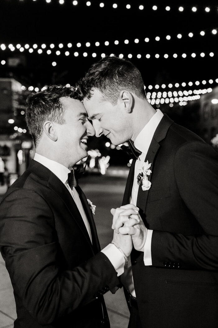 grooms walking on the street together