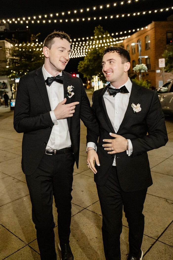 grooms walking on the street together