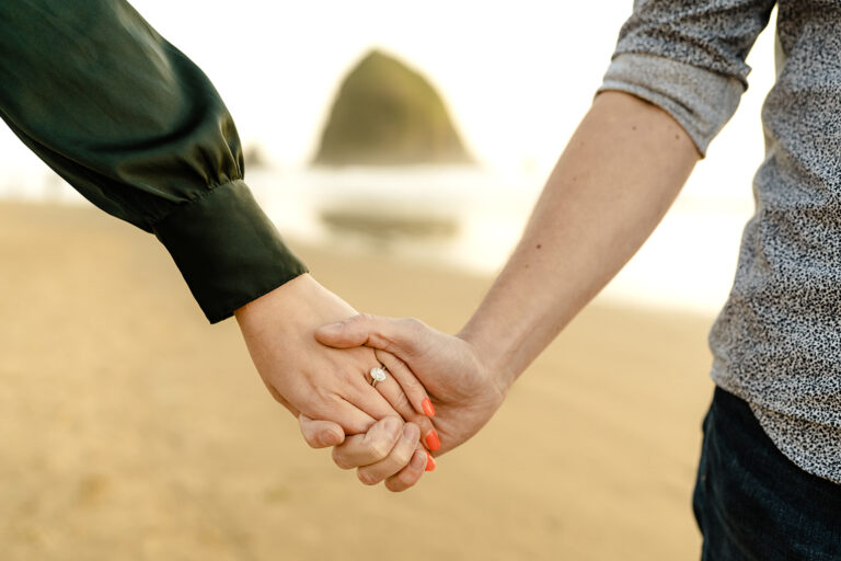hand holding with engagement ring
