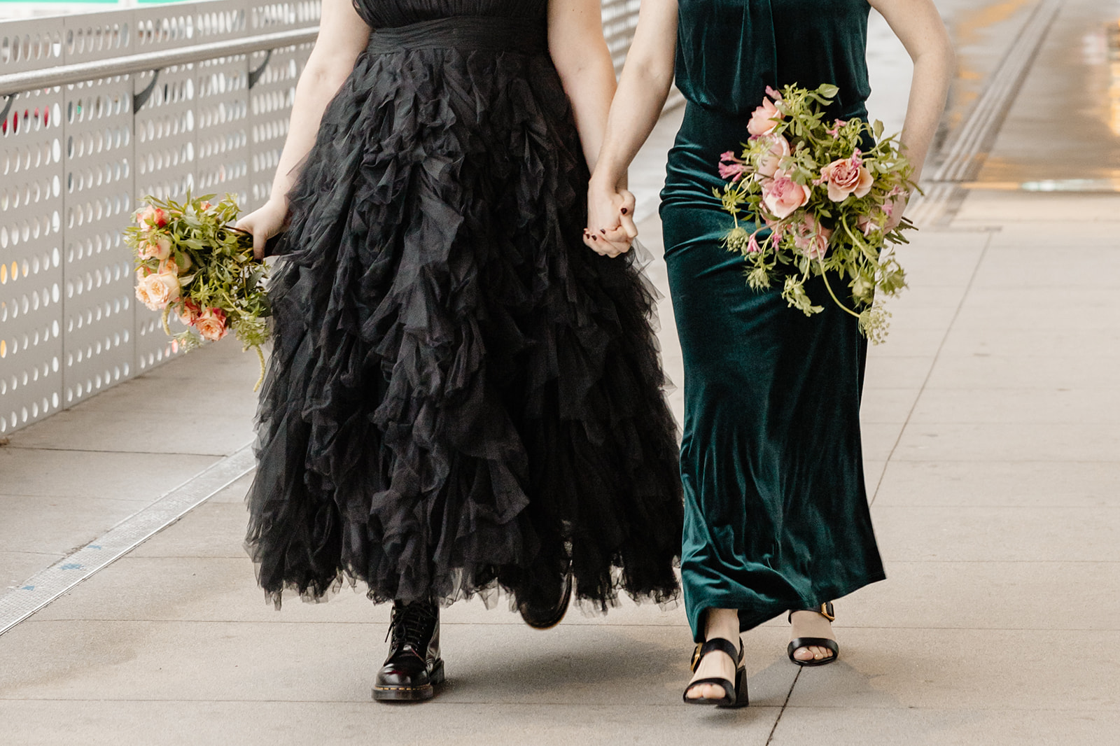 brides in a black dress and green dress