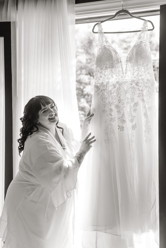 bride next to her dress