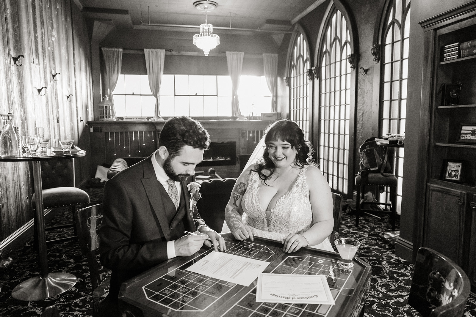 bride and groom sign marriage license