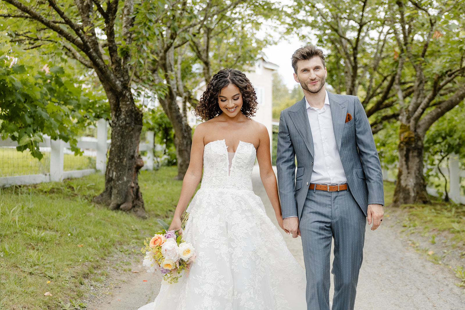 bride and groom walk at chateau lill