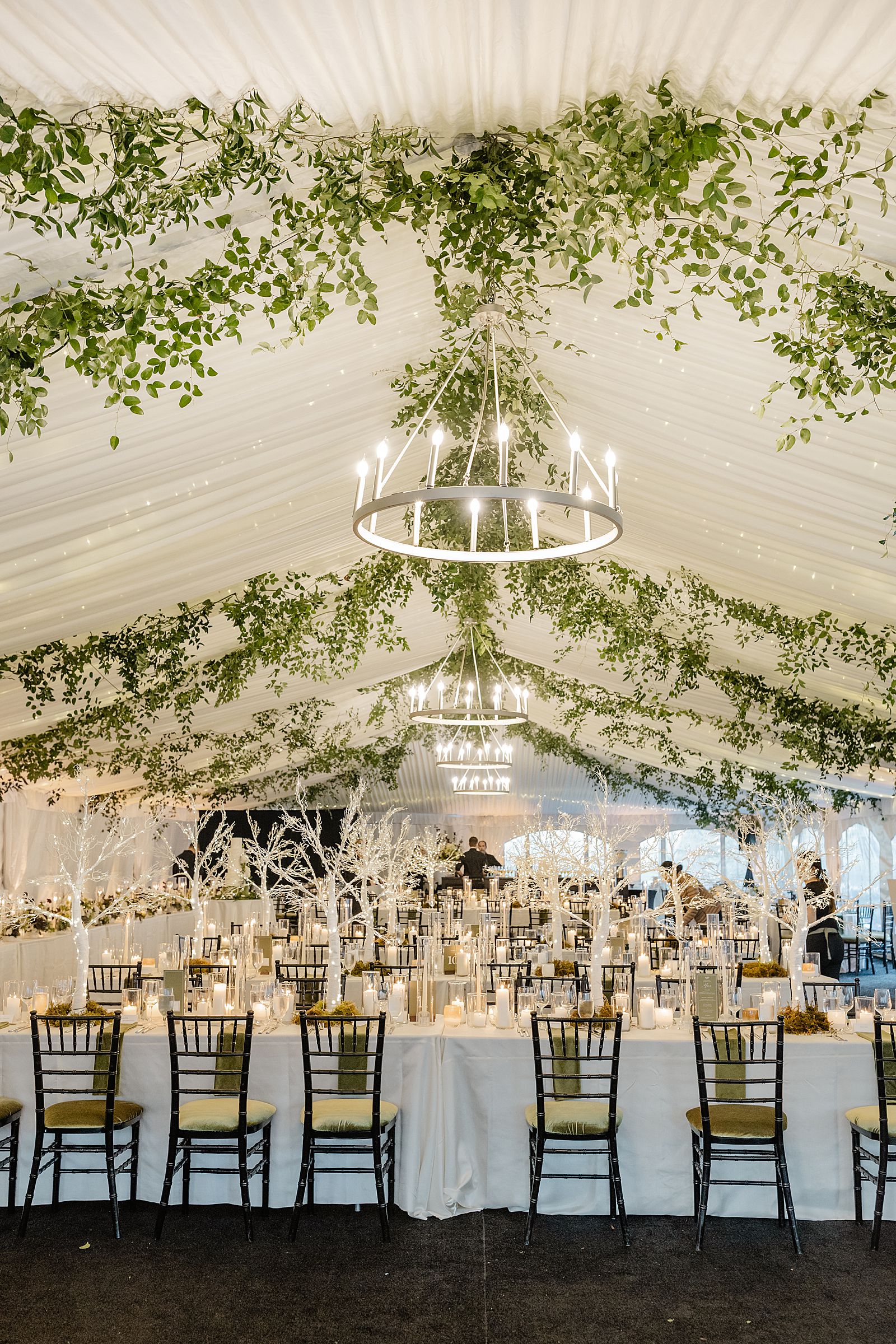 wedding rain plan white tent with greenery floral design