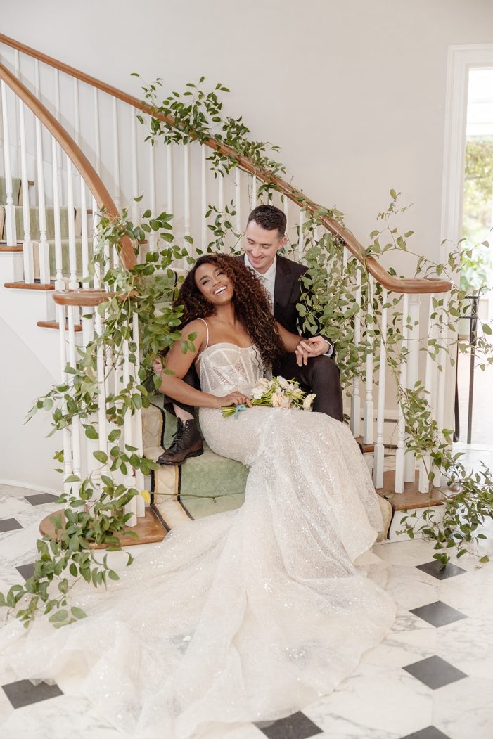 bride and groom on steps