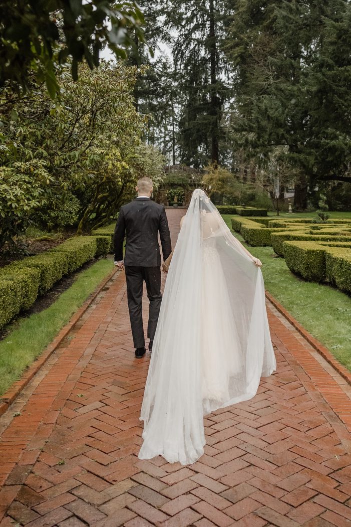 bride and groom walk through lakewold gardens
