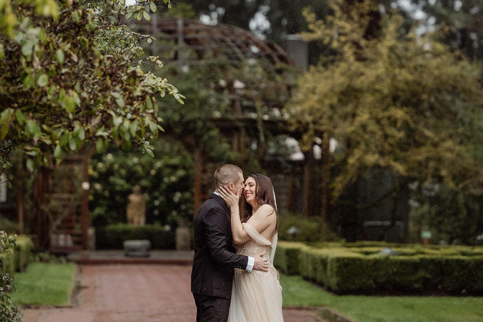 bride and groom walk through lakewold gardens