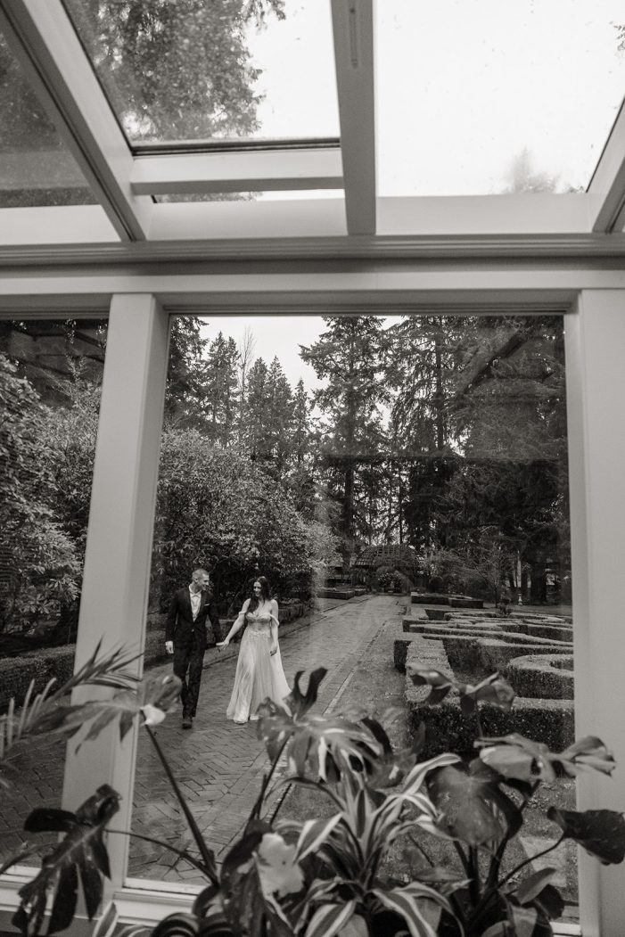 bride and groom walk through lakewold gardens