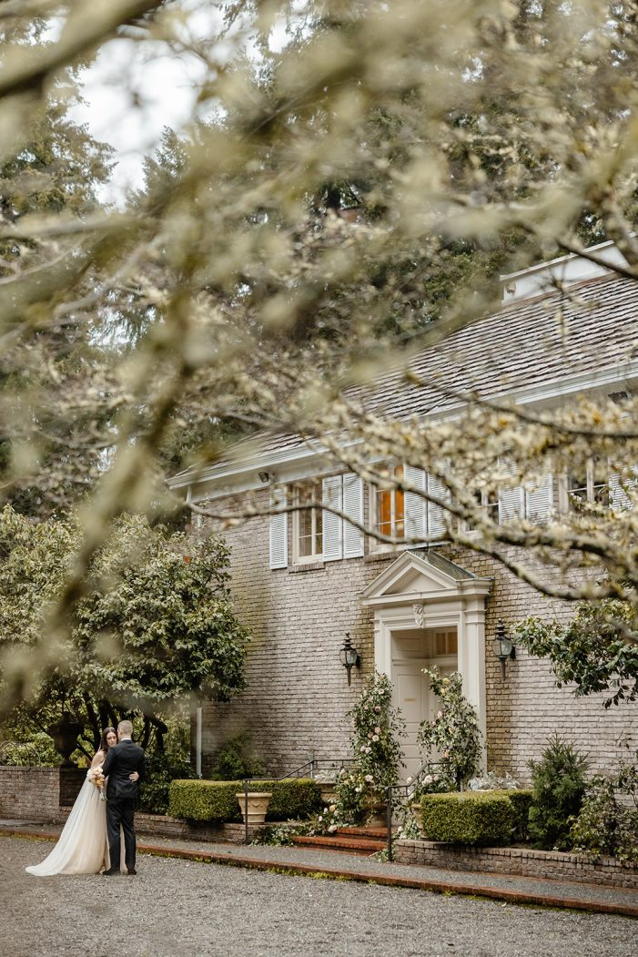 bride and groom walk through lakewold gardens