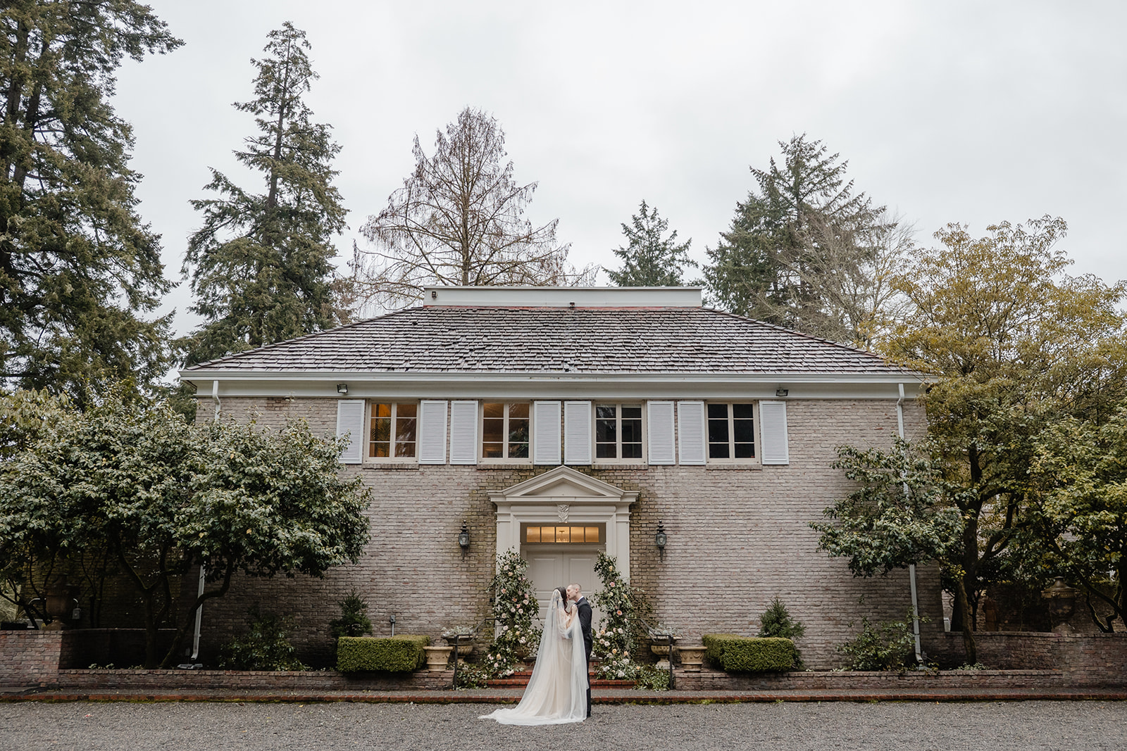 bride and groom walk through lakewold gardens