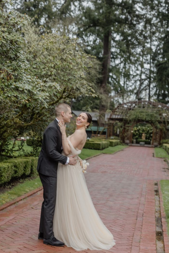 bride and groom walk through lakewold gardens