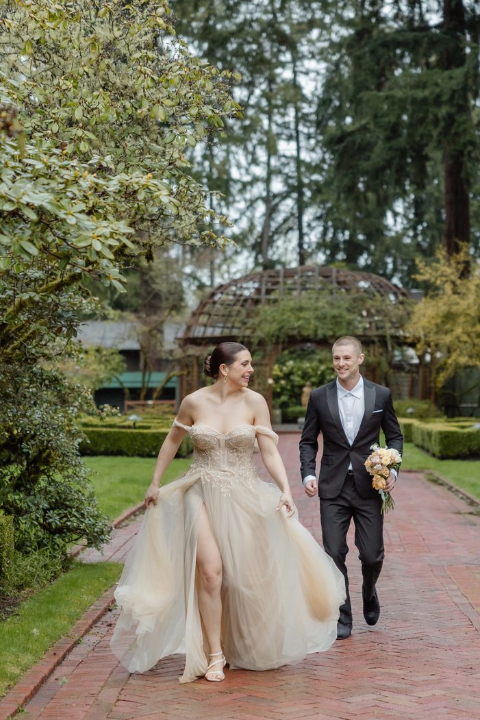 bride and groom walk through lakewold gardens