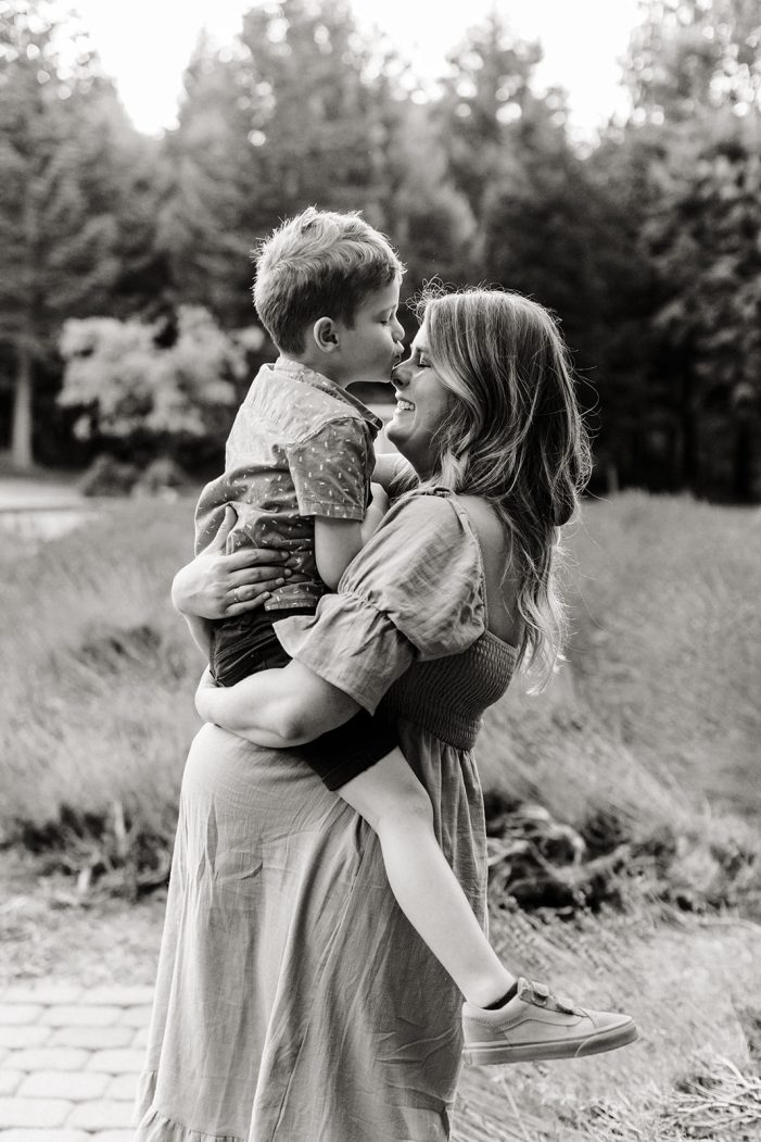 mom holds son in arms