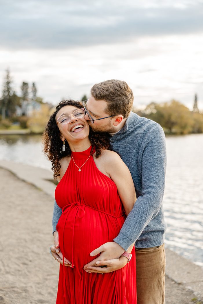 man kisses woman on cheek
