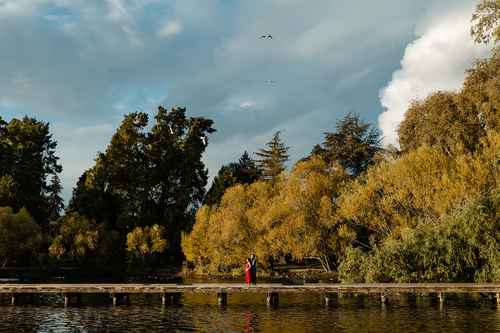 wide of couple with lake
