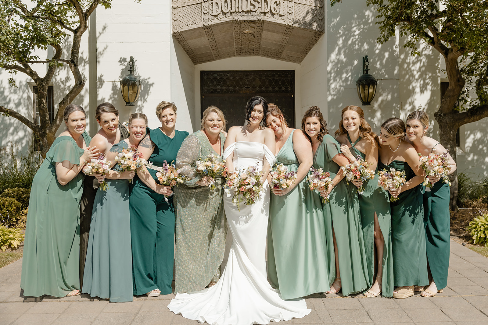 bride and bridesmaids in front of church