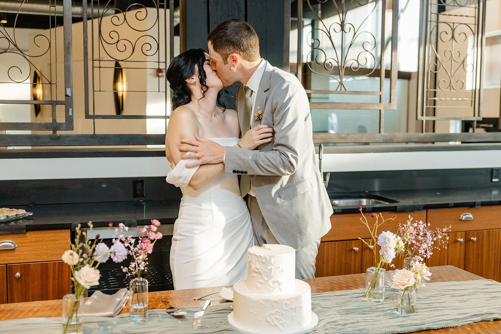 bride and groom cut cake
