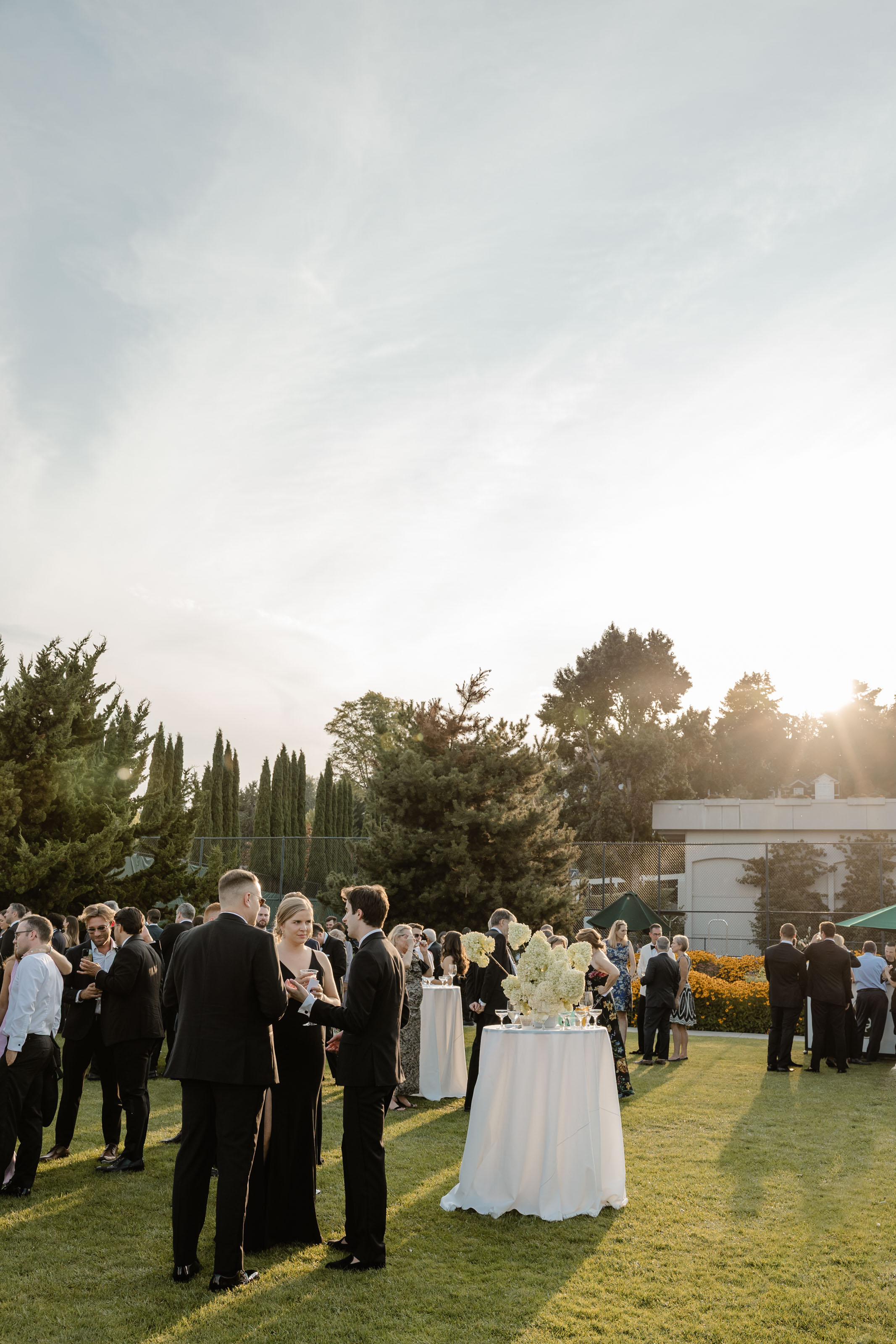 cocktail hour with sunlight wedding photographer seattle tennis club