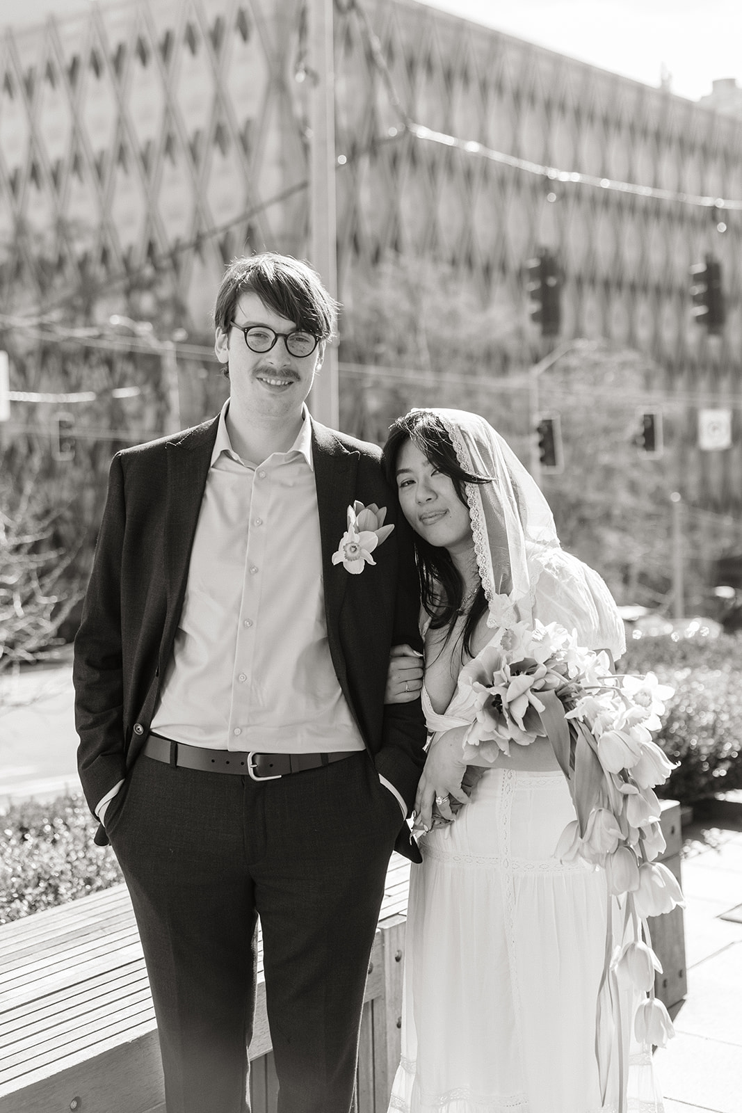 elopement photographer seattle courthouse couple looking at camera formal portrait
