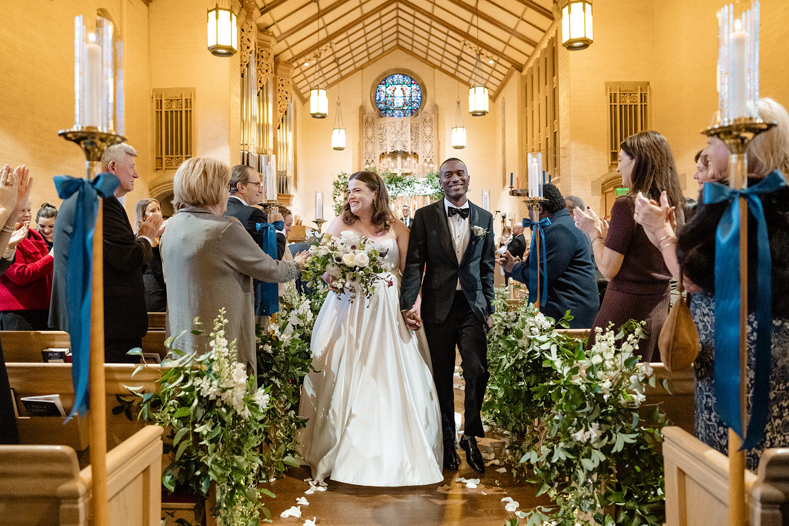bride and groom walk back up aisle