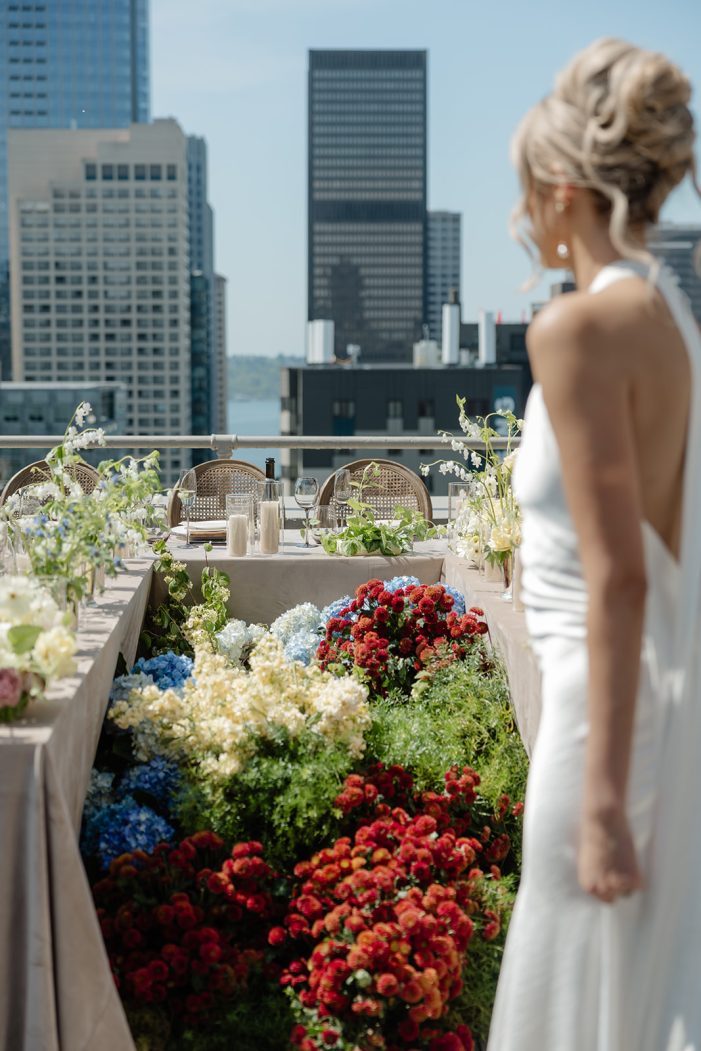bride walks past table