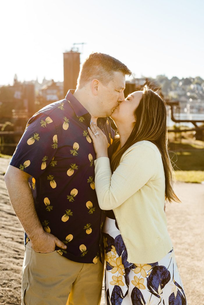 couple kisses in front of gas works park