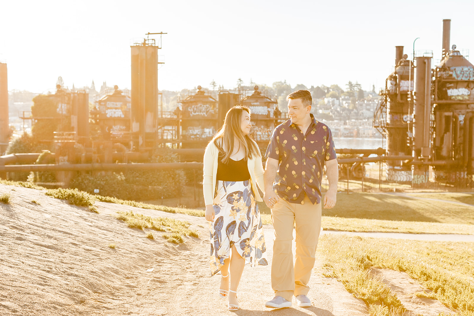 couple walks away from gas works park