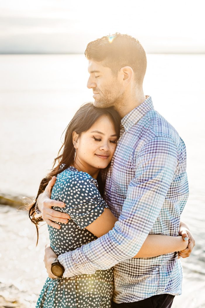 man and woman embrace in sun