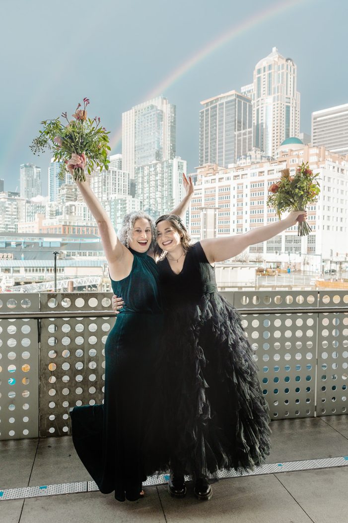 two brides with seattle in the background