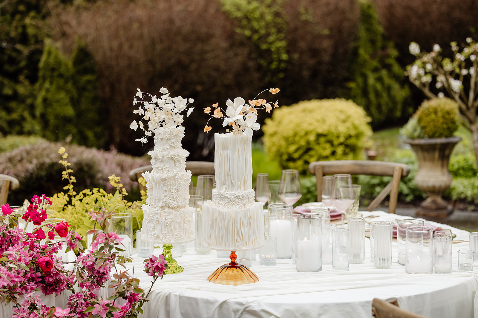 cakes on a tablescape set up in a garden