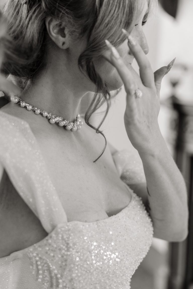 bride wipes away tear
