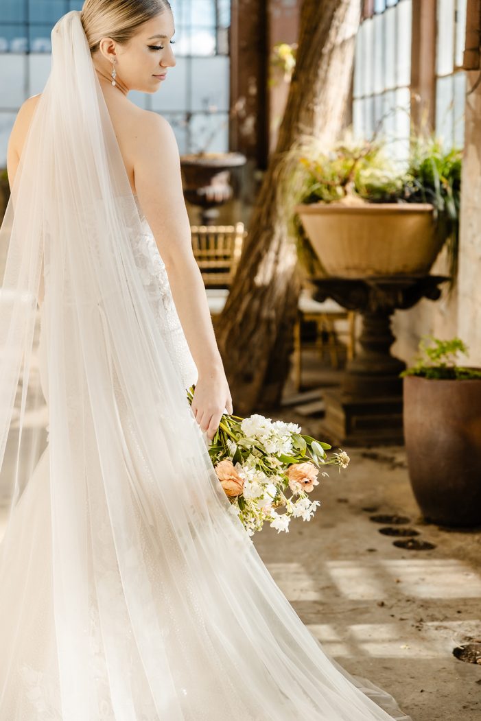 wildflower bouquet held down at bride's side