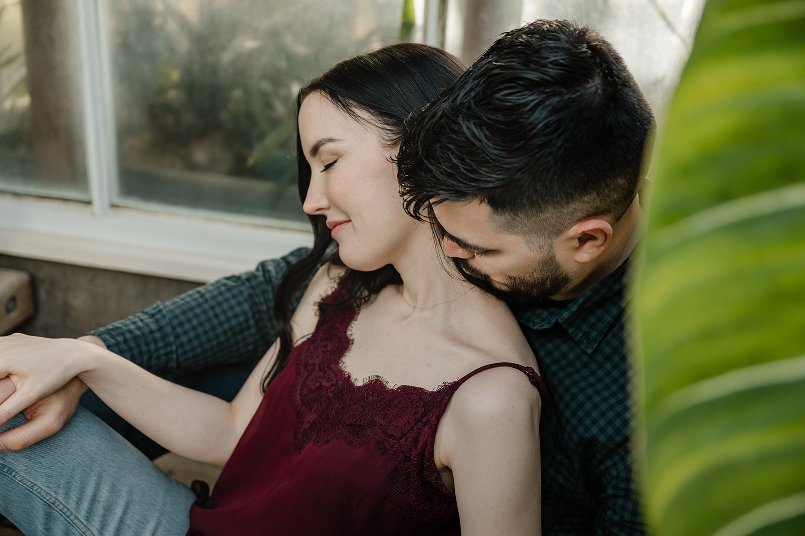 man and woman in greenhouse