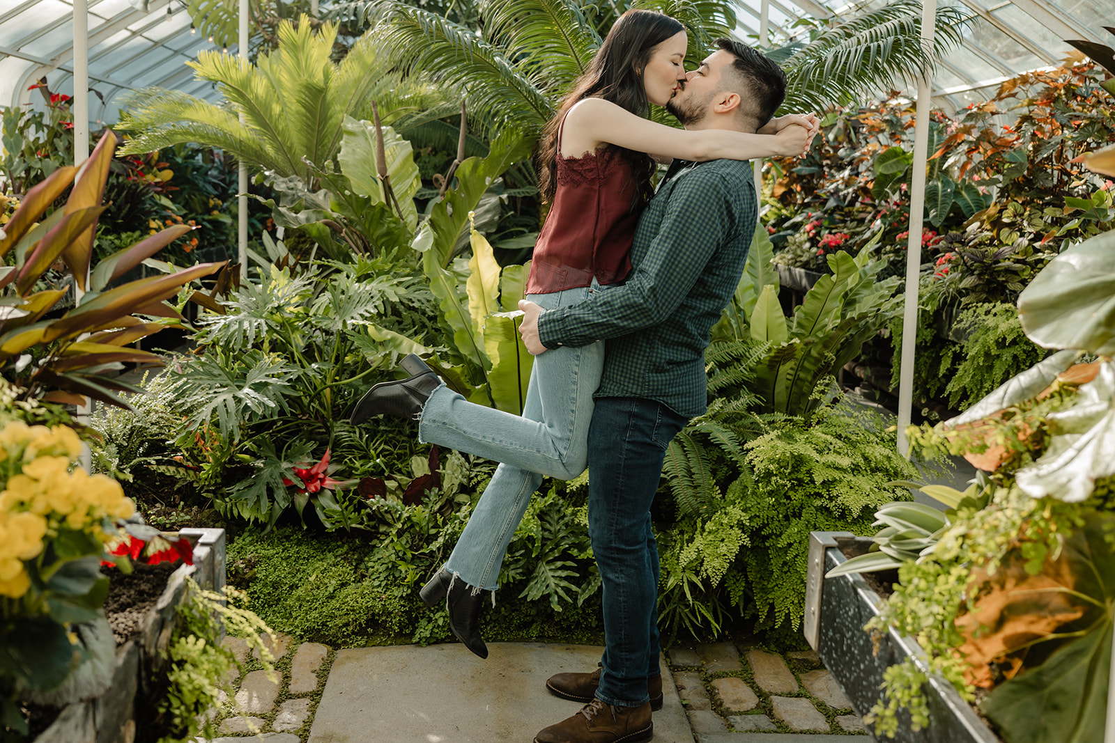 man and woman in greenhouse