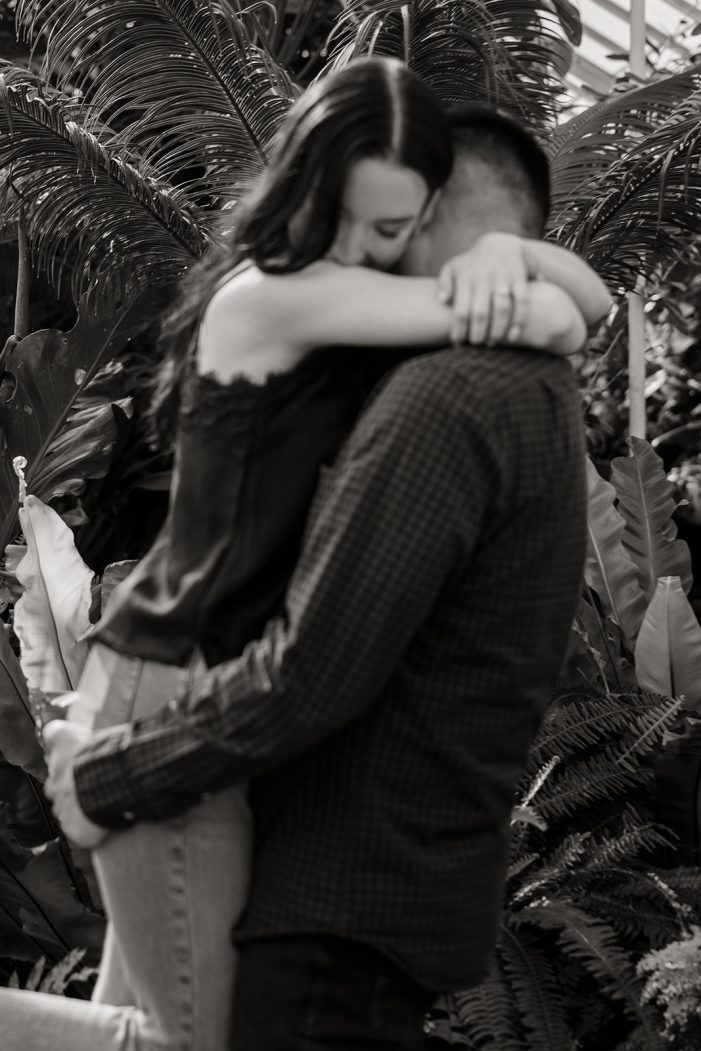 man and woman in greenhouse