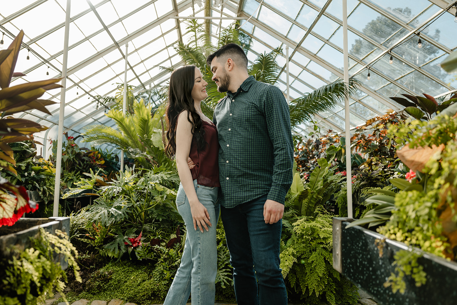 man and woman in greenhouse