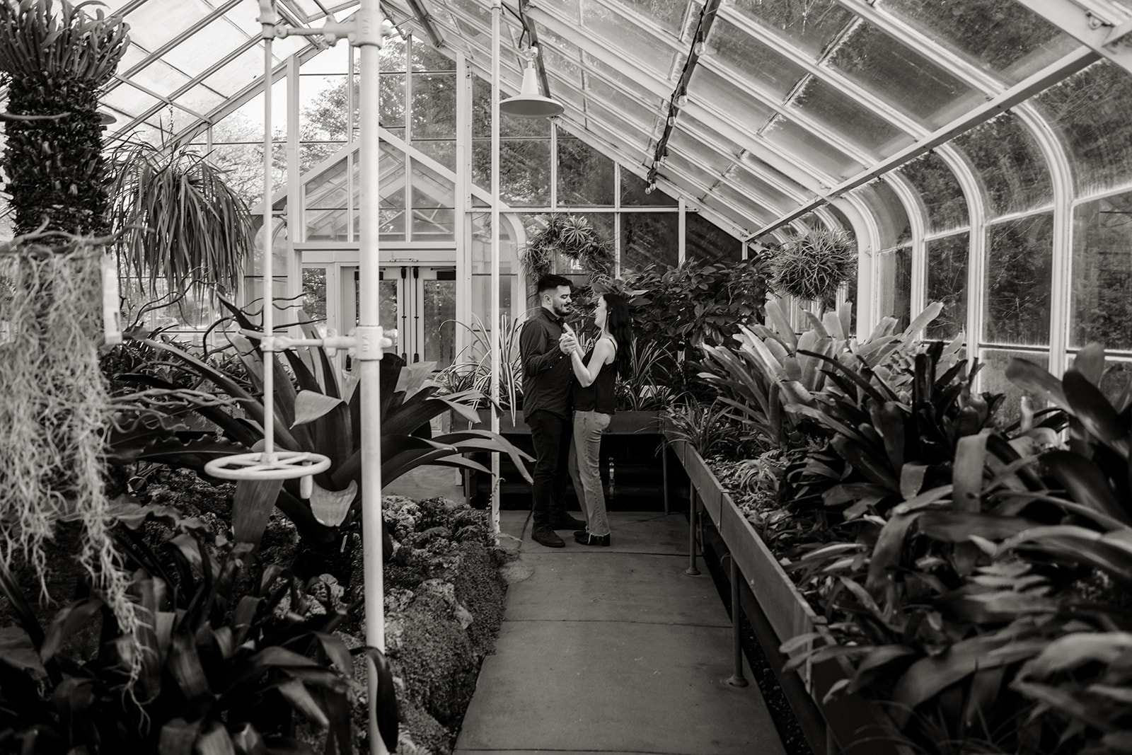 man and woman in greenhouse