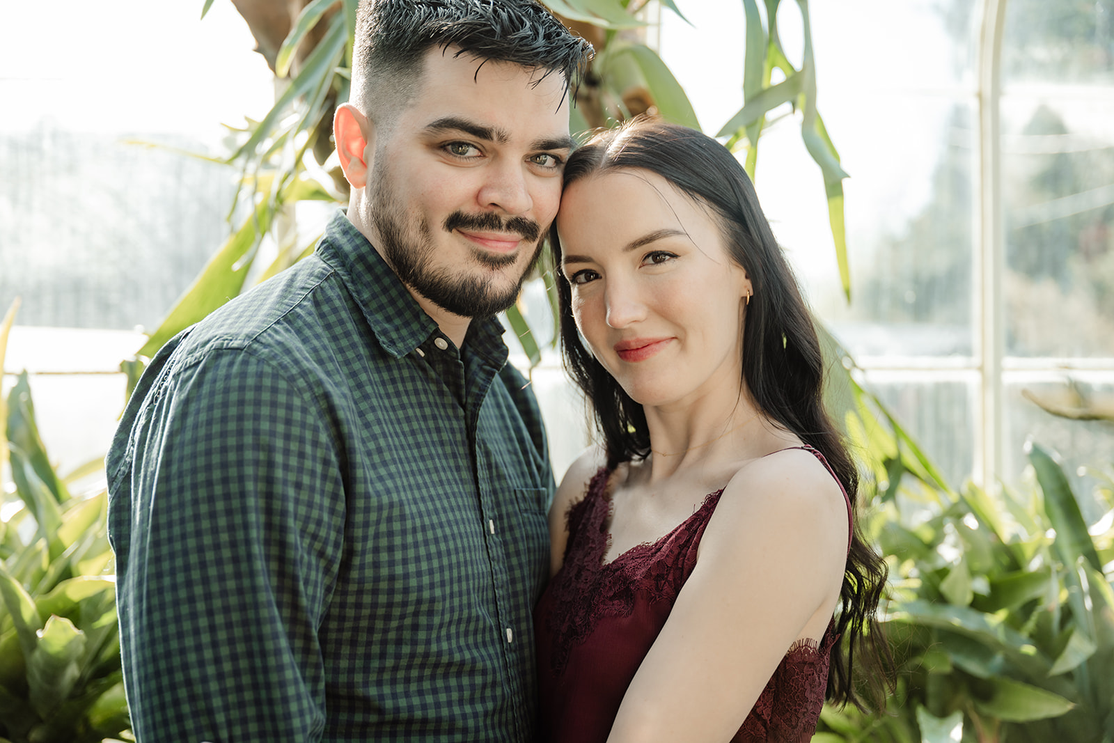 man and woman in greenhouse
