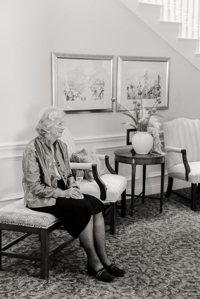 older woman sitting on a chair