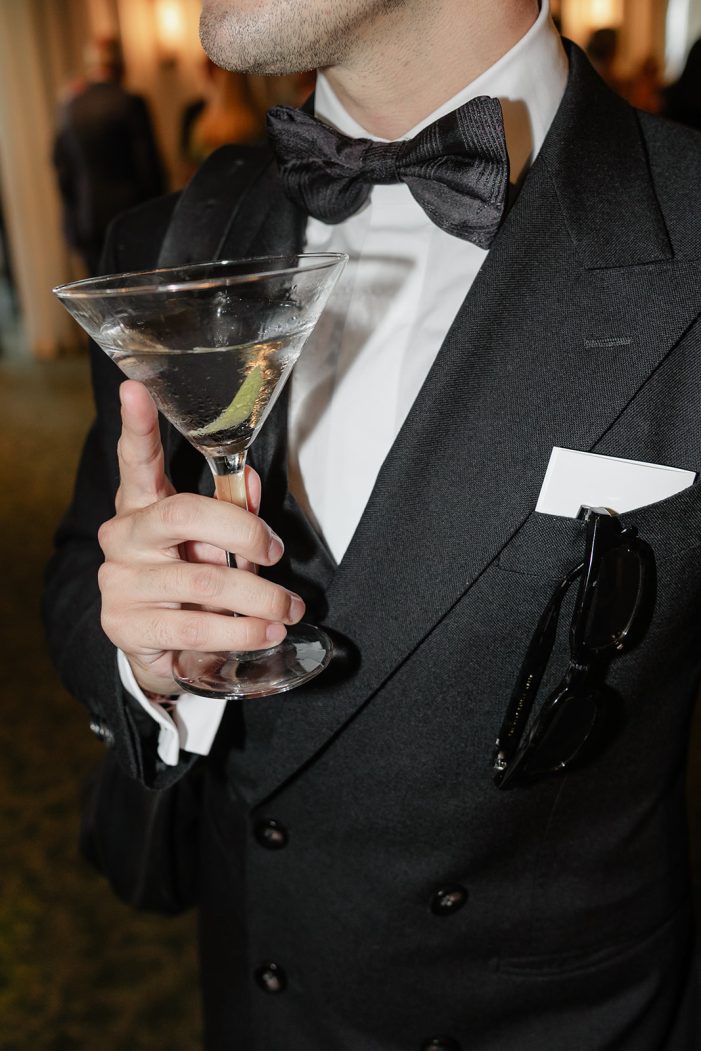 man holding a martini
