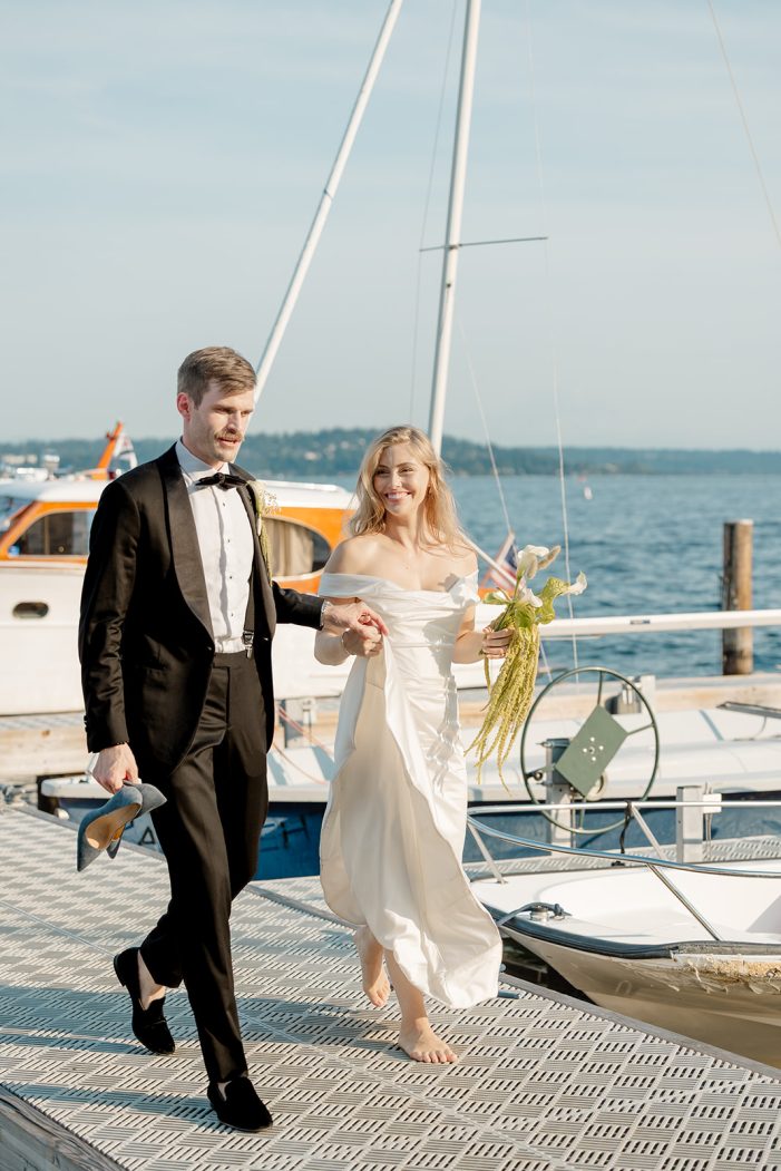 bride and groom walk on deck
