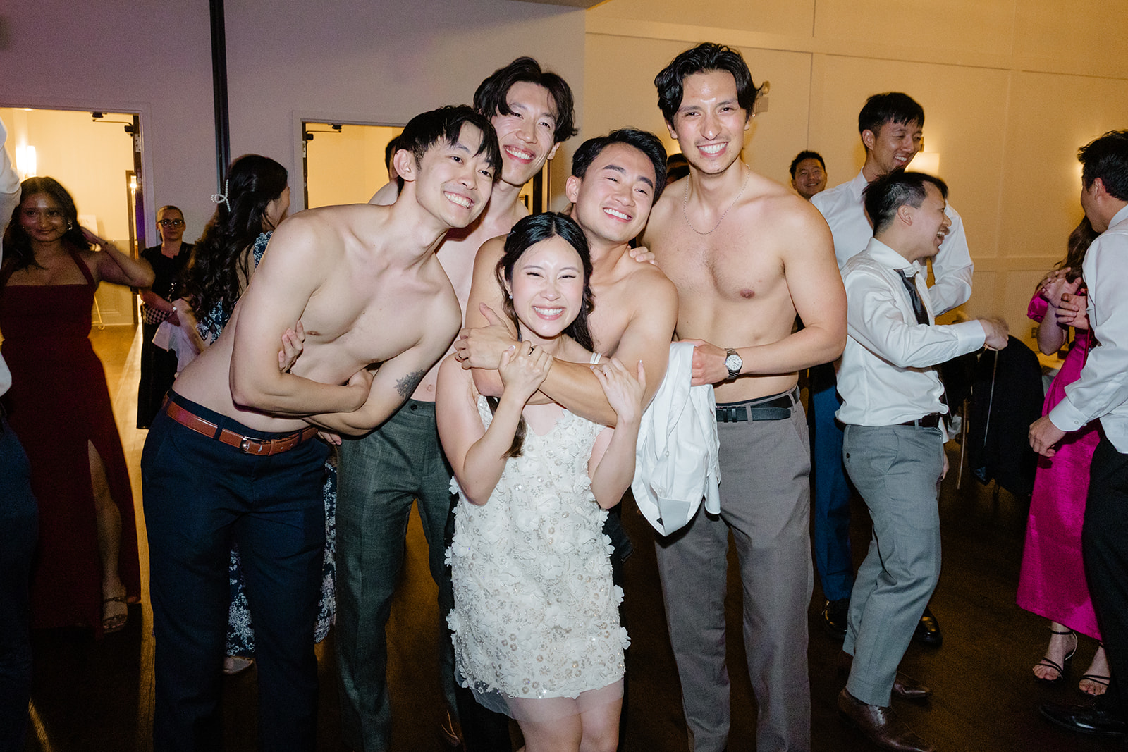 bride with shirtless men