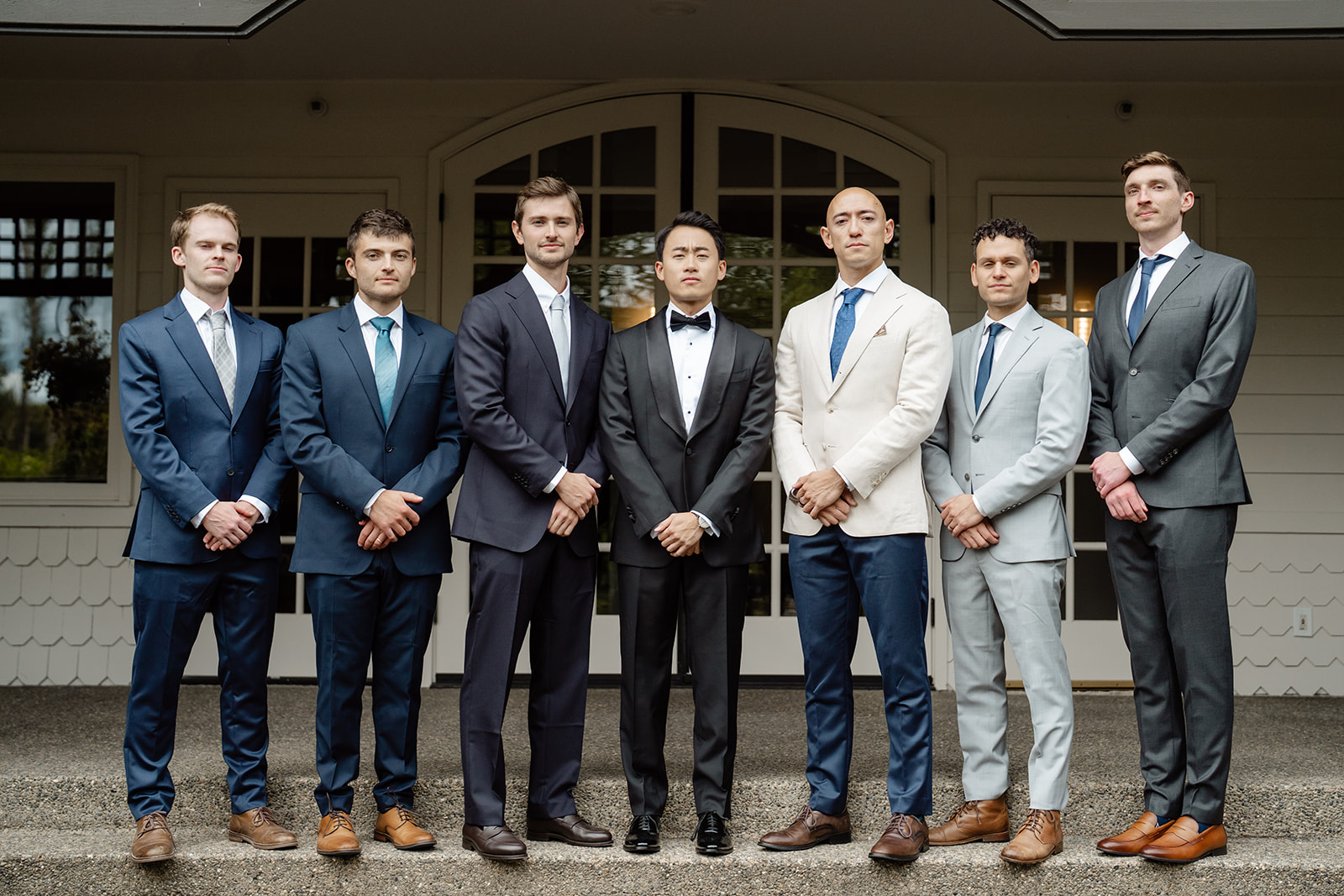 groom and groomsman on steps