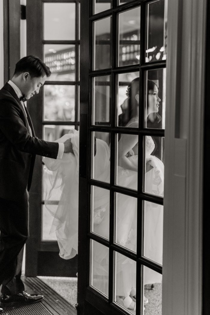 bride and groom walk through door