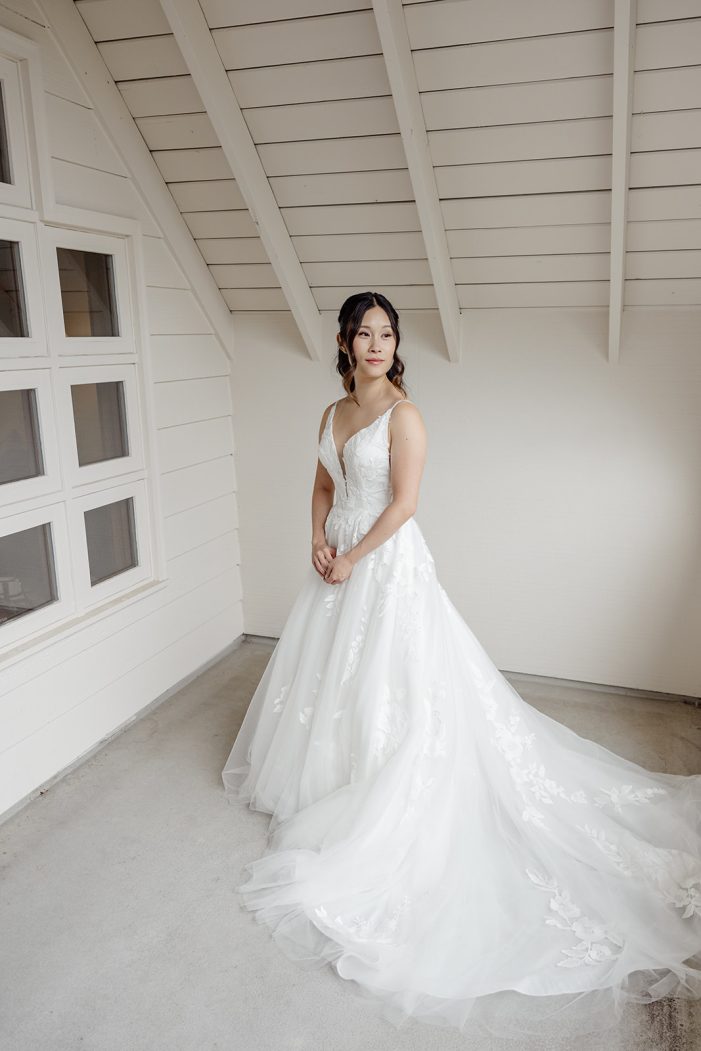 bride against a white wall
