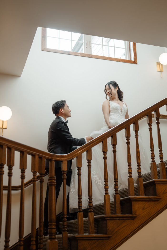 bride and groom walking up stairs