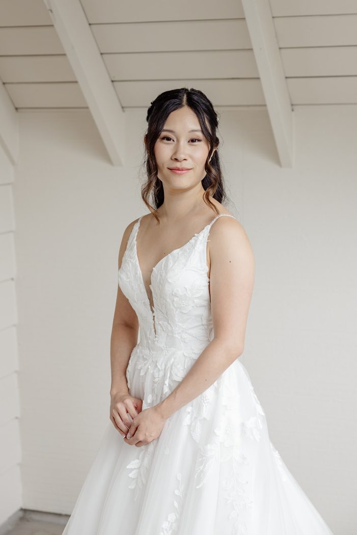 bride against a white wall