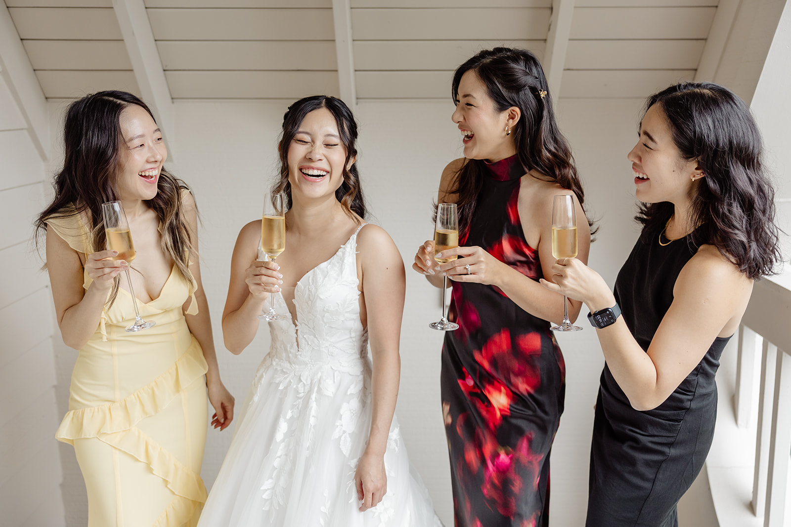 bride cheers with bridesmaids